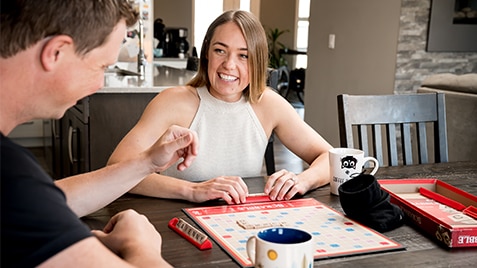 woman and man playing board game
